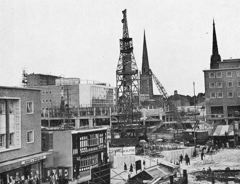 Monochrome photograph of a huge crane installed for the construction of the Link Block in the precinct.