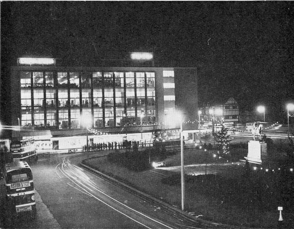 Monochrome photograph of the Owen Owen Store in Broadgate Coventry, lit up and decorated for Christmas.