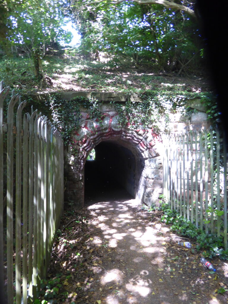 Photograph showing the entrance to the tunnel underneath the railway line. 