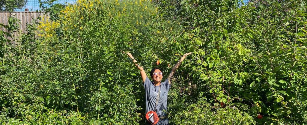 Photo of child in front of Tiny Forest