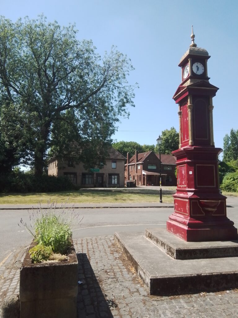 Photograph of a Victorian clock in an iron mounting.
