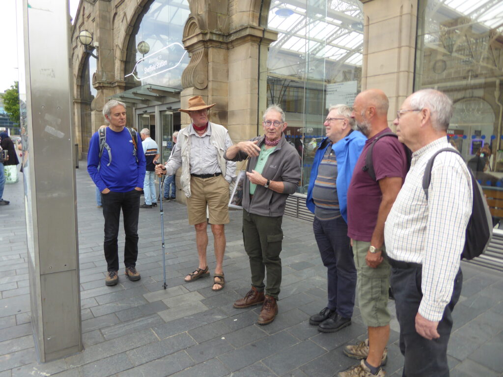 Photograph of CovSoc member being greeted at Sheffield railway station