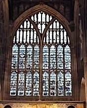 Colour photograph of a large church window. 