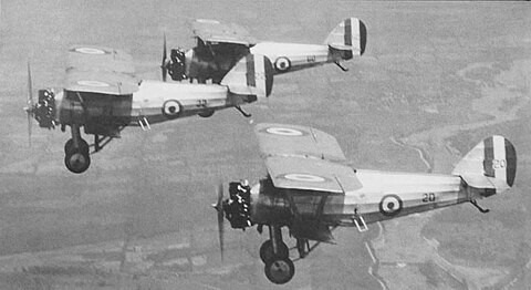 Monochrome image of  three first world war aircraft flying in formation.