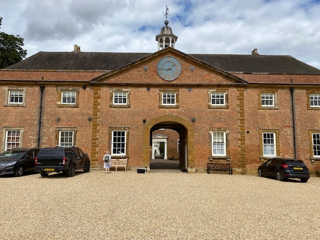 Colour photograph of the stable block at Stanford Hall