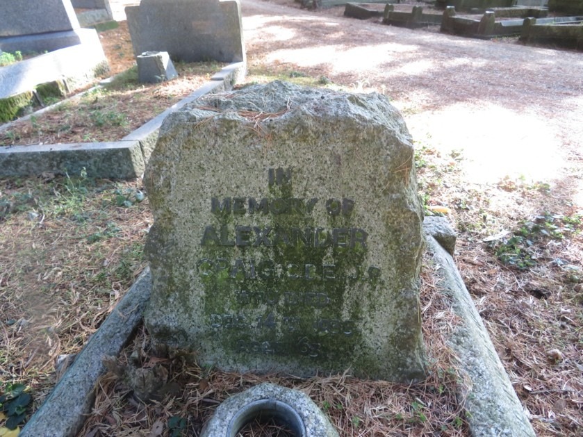 Colour photograph of a grave and grave stone. 