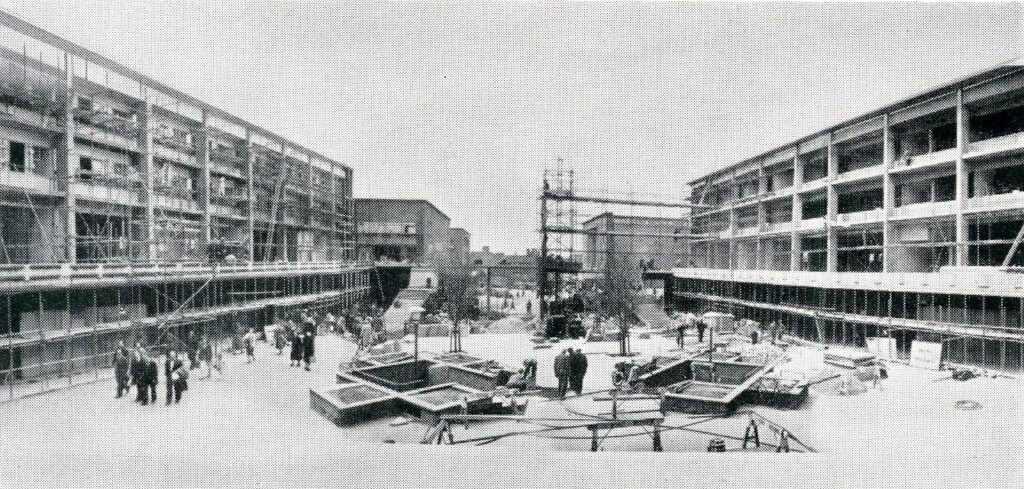 Monochrome photograph showing building work in the Upper Precinct.
