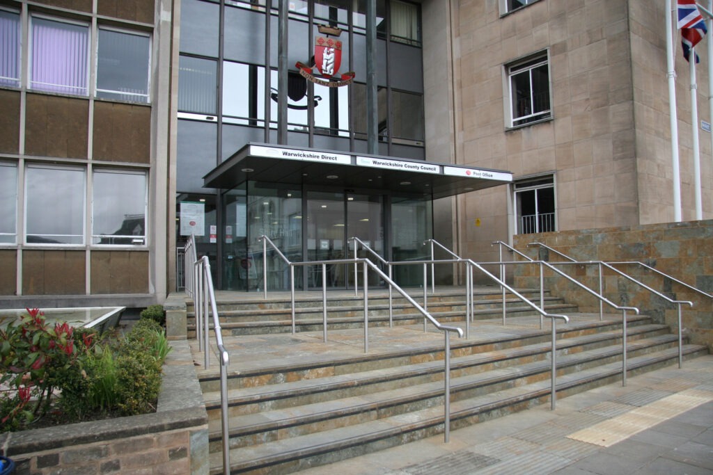 Colour photograph of the steps leading to the foyer of county hall in Warwick.