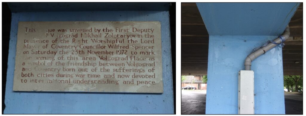 Two colour photographs. The left one shows the old plaque, very faded and difficult to read. The right hand photograph shows a rainway pipe running down the column where the plaque was once sited.