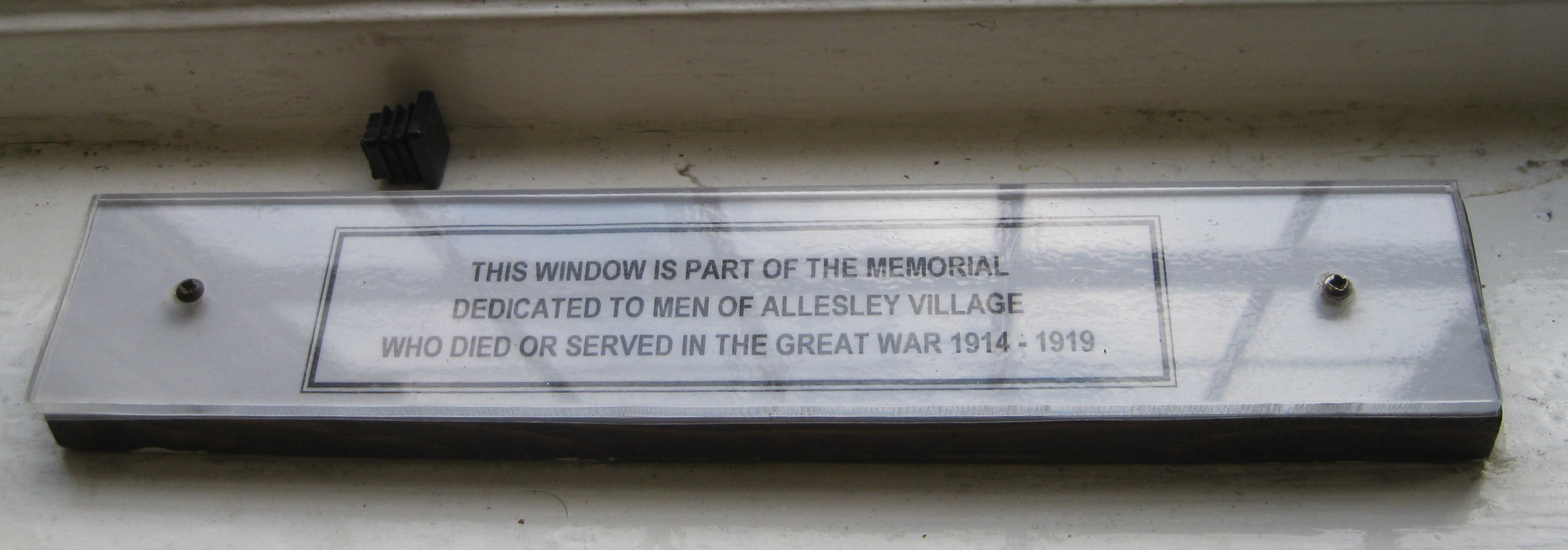 Plaque at Memorial window at Allesley Village Hall